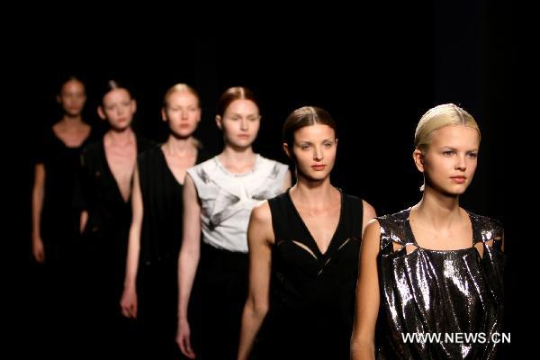 Models display creations of SERGIO ZAMBON during the Women's fashion week in Milan, Italy, Sept. 28, 2010. The Fashion Week finished on Tuesday.