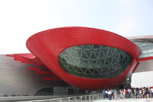The Historic Museum, whose red 'shell' highlights the Asian Games Town Gymnasium.