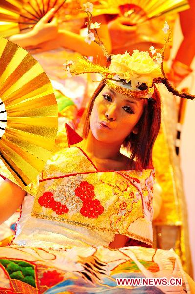 Artists in traditional Japanese costumes perform at Expo