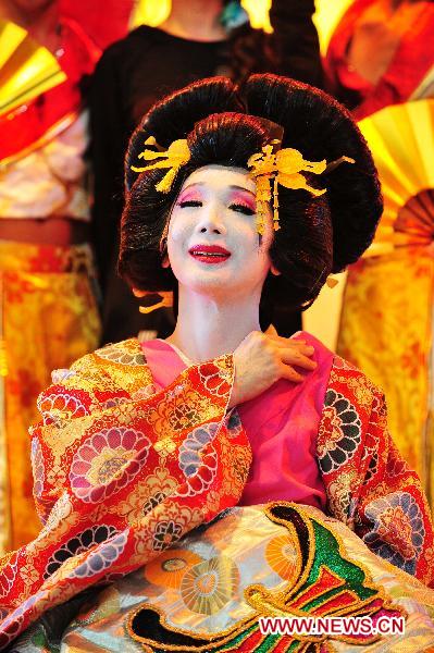 Artists in traditional Japanese costumes perform at Expo