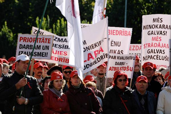 Latvian Free Trade Union Confederation's workers take part in a 'No to austerity, Priority for jobs and growth!' protest in Riga, capital of Latvia, Sept. 29, 2010. Nearly one thousand workers of Latvia attended the protest on Wednesday to protest against the government's austerity measures. [Yang Dehong/Xinhua]