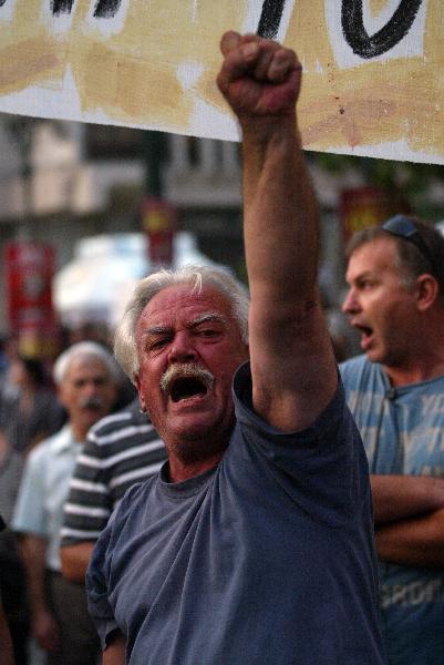 Greek labour unions of civil servants and private sector employees protest over the harsh austerity measures implemented by the government this year to overcome an acute debt crisis in Athens, capital of Greece, Sept. 29, 2010, to mark the European Day of Action. [Marios Lolos/Xinhua]