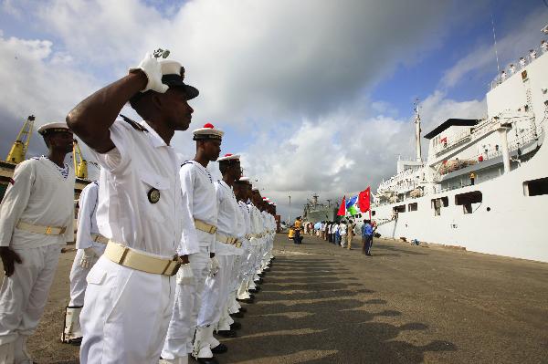 Djibouti navy soldiers salute in front of China's hospital ship Peace Ark at the port of Djibouti, Sept. 29, 2010. The Peace Ark left for Kenya on Wednesday after providing medical services for local residents in Djibouti for a week. [Xinhua photo]