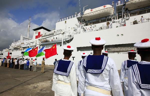 Djibouti navy soldiers stand in formation in front of China's hospital ship Peace Ark at the port of Djibouti, Sept. 29, 2010. The Peace Ark left for Kenya on Wednesday after providing medical services for local residents in Djibouti for a week. [Xinhua photo]