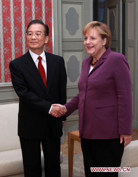 Chinese Premier Wen Jiabao (L) meets with German Chancellor Angela Merkel at the Meseberg Palace, north of Berlin, Germany, Oct. 5, 2010. [Xinhua/Pang Xinglei]