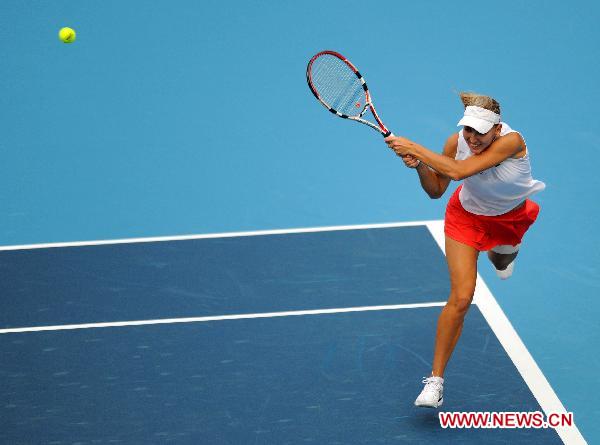 Elena Vesnina of Russia returns the ball during the women's singles match against her compatriot Maria Sharapova at 2010 China Tennis Open Tournament in Beijing, capital of China, Oct. 5, 2010. Vesnina won 2-0. (Xinhua/Gong Lei) 