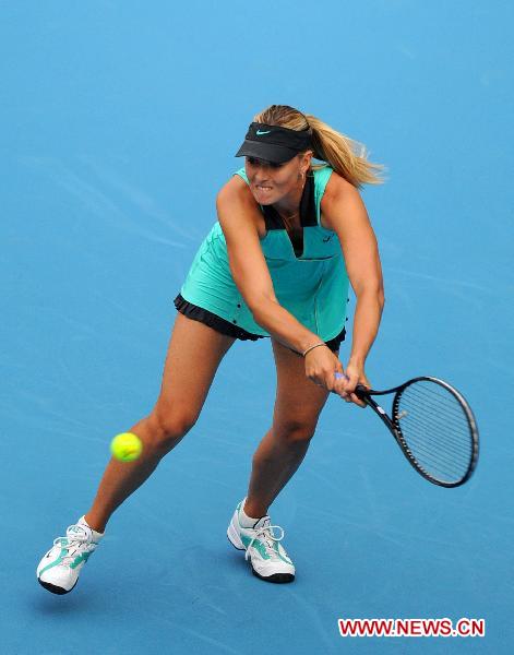 Maria Sharapova of Russia returns the ball during the women's singles match against her compatriot Elena Vesnina at 2010 China Tennis Open Tournament in Beijing, capital of China, Oct. 5, 2010. Sharapova lost 0-2. [Xinhua/Gong Lei]