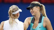 Maria Sharapova (R) of Russia greets her compatriot Elena Vesnina after their second round match of women's singles in 2010 China Tennis Open Tournament in Beijing, China, Oct. 5, 2010. Sharapova lost 0-2. [Xinhua/Wang Lili]