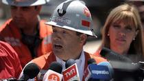 Andre Sougarret (C), chief of the rescue operations, talks to the press by the San Jose mine, near Copiapo, 800 km north of Santiago, Chile, on Oct. 5, 2010, where 33 miners remain trapped since a shaft collapsed on August 5. [Xinhua/Jorge Villegas]