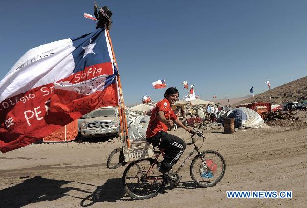 A bicycle rider travels to San Jose Mine to support the families of the miners that still trapped underground at the San Jose Mine, 800 km north of the Chilean capital Santiago on Oct. 6, 2010. The 33 miners have been trapped 700 meters underground for two months by far as the rescue operation hopefully enters its final phase. [Xinhua] 