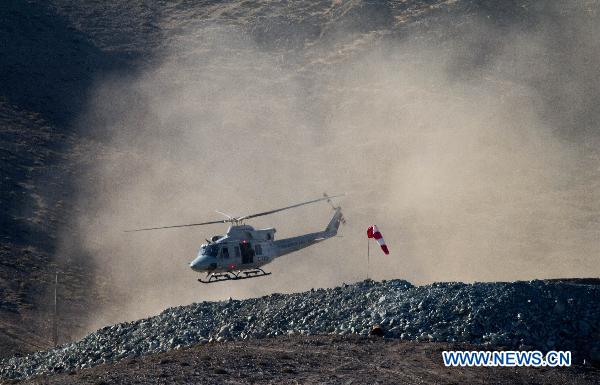 A helicopter takes part in a rescue simulation at the San Jose Mine, 800 km north of the Chilean capital Santiago on Oct. 7, 2010. The 33 miners have been trapped 700 meters underground for two months by far as the rescue operation hopefully enters its final phase. [Xinhua]