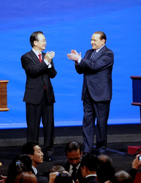 Chinese Premier Wen Jiabao (L, center) and his Italian counterpart Silvio Berlusconi (R, center) clap hands during the opening ceremony of Chinese Cultural Year in Italy, which is also a celebration of the establishment of diplomatic ties between two countries 40 years ago, in Rome, Italy, Oct. 7, 2010. [Rao Aimin/Xinhua]