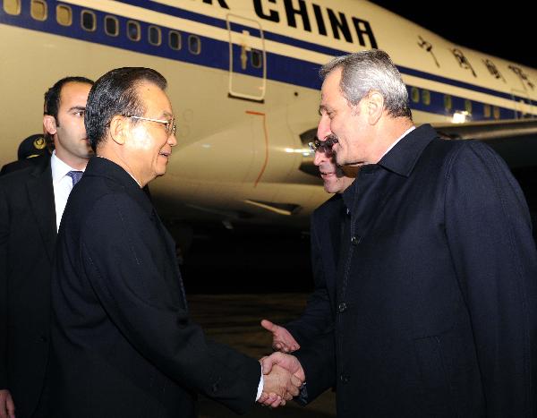 Chinese Premier Wen Jiabao (L, front) arrives in Ankara, capital of Turkey, for an offical visit, on Oct. 7, 2010. [Rao Aimin/Xinhua]