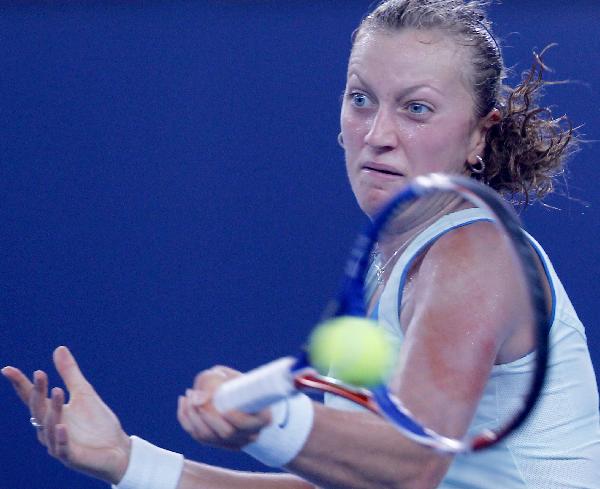 Petra Kvitova of the Czech Republic hits a return against Caroline Wozniacki of Denmark during the women's singles third round match at the China Open tennis tournament in Beijing, capital of China, Oct. 7, 2010. Kvitova lost 0-2. (Xinhua/Chen Jianli)