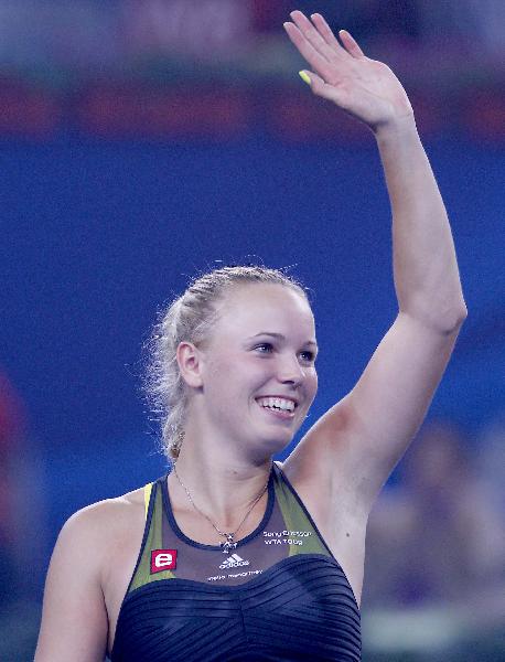 Caroline Wozniacki of Denmark waves to the crowd after winning the women's singles third round match against Petra Kvitova of the Czech Republic at the China Open tennis tournament in Beijing, capital of China, Oct. 7, 2010. Wozniacki won 2-0. (Xinhua/Chen Jianli) 