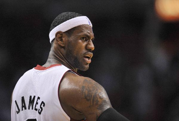 Miami Heat forward LeBron James reacts during a break in play against the Detroit Pistons in their NBA preseason basketball game in Miami, Florida October 5, 2010. (Xinhua/Reuters Photo)