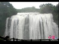 Huangguoshu Waterfall is the largest waterfall in Asia. Seventy-four meters (243 feet) high and eighty-one meters (266 feet) wide, it is a scenic marvel. Known as the Huangguoshu Waterfall National Park, it is 45 kilometers (28 miles) southwest of Anshun city in Guizhou Province. [Photo by Lu Nan]