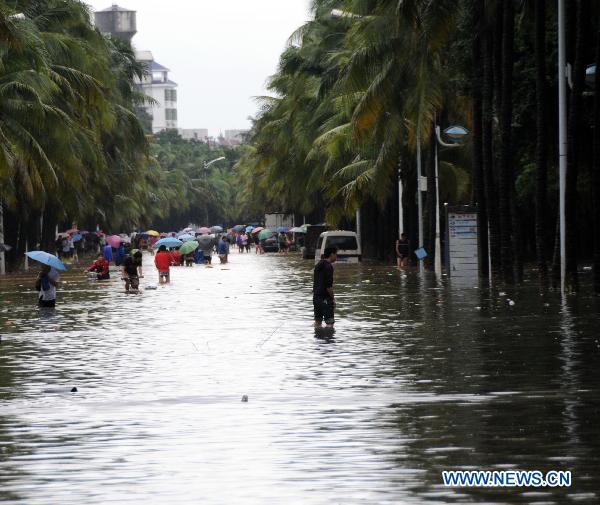 Photo taken on Oct. 8, 2010 shows a waterlogged street in Haikou, capital of south China&apos;s Hainan Province. From Sept. 30 to Oct. 8, Hainan saw 608.1 millimeters of rainfall, the highest on record, a statement from China&apos;s National Meteorological Center (NMC) said. More than 210,000 people had been evacuated after about 1,160 villages were submerged by floodwaters as of Thursday. 