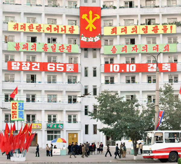 Banners praising ruling Workers&apos; Party of Korea of the Democratic People&apos;s Republic of Korea (DPRK) hang on the exterior of a building in Pyongyang on Oct 7, 2010. The celebrating ceremony is scheduled to be held on Oct 10, 2010. [China Daily/Agencies]