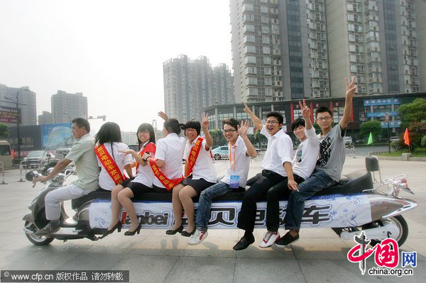 A 5.2 meters long electric bicycle, has 8 seats, appears during the 31th(2010) China Zhejiang International Bicycle Electric-Cycle Exhibition at Hangzhou Peace International Exhibition and Conference Center on October 9, 2010 in Hangzhou, southeast China&apos;s Zhejiang Province. [CFP]