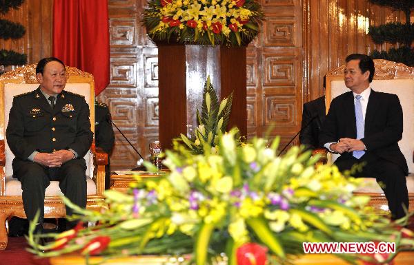 Vietnamese Prime Minister Nguyen Tan Dung (R) meets with Chinese Defense Minister Liang Guanglie in Hanoi, Vietnam, Oct 11, 2010. Chinese Defense Minister Liang Guanglie arrived here Sunday to attend a regional security conference and visit Vietnam. [Huang Xiaoyong/Xinhua]