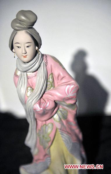Photo taken on Oct. 10, 2010 shows a painted sculpture during an exhibition of Zhang Naiying, the fifth-generation successor of Clay Figure Zhang, at the National Art Museum of China in Beijing, capital of China. 