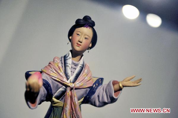 Photo taken on Oct. 10, 2010 shows a painted sculpture work during an exhibition of Zhang Naiying, the fifth-generation successor of Clay Figure Zhang, at the National Art Museum of China in Beijing, capital of China.