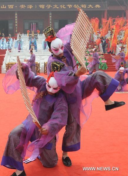 Troupers in traditional costumes perform sacrifice dance at a memorial ceremony for Xun Zi, an ancient Chinese thinker and educator, in Anze County, north China's Shanxi Province, Oct. 10, 2010. The fifth China Xun Zi Cultural Festival kicked off here on Sunday. Xun Zi, by the name of Xun Kuang, was one of the great early contributors to Confucianism along with Confucius and Mencius during the Warring States period (403-221 B.C) in China.