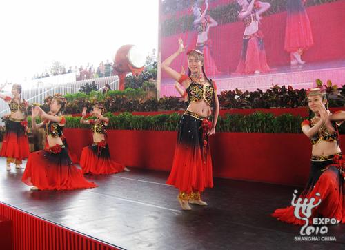 Dancers entertain waiting visitors. 