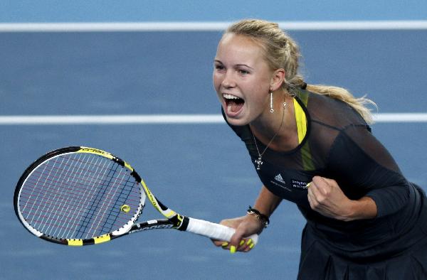 Caroline Wozniacki of Denmark reacts after winning her final of women&apos;s singles against Vera Zvonareva of Russia in 2010 China Tennis Open Tournament at Lotus Court in National Tennis Center in Beijing, capital of China, Oct. 11, 2010. Wozniacki won 2-1 and claimed the title of the event. [Xinhua]