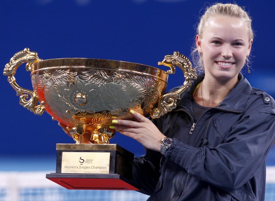 Caroline Wozniacki of Denmark, the top-seed women's singles, crowned in the China Open finals in Beijing on Monday. 