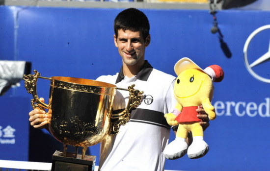 Reigning champion Novak Djokovic beat Spanish eighth seed David Ferrer 6-2, 6-4 in the rain-interrupted final match, successfully to defend his title in the China Open finals in Beijing on Monday. 