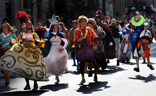 Dressed-up revellers parade along the 5th Avenue in Manhattan, New York City, Oct 11, 2010 to celebrate the annual Columbus Day. [Xinhua]