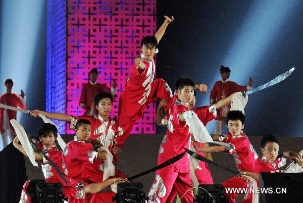 Artists perform during the opening ceremony of the eighth Cangzhou International Martial Arts Festival at Shicheng Square of Cangzhou City, north China's Hebei Province, Oct. 9, 2010.