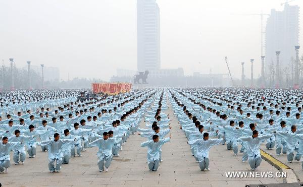 People perform traditional Chinese martial arts at Shicheng Square of Cangzhou City, north China's Hebei Province, Oct. 10, 2010. The eighth Cangzhou International Martial Arts Festival was opened on Oct.9, 2010.