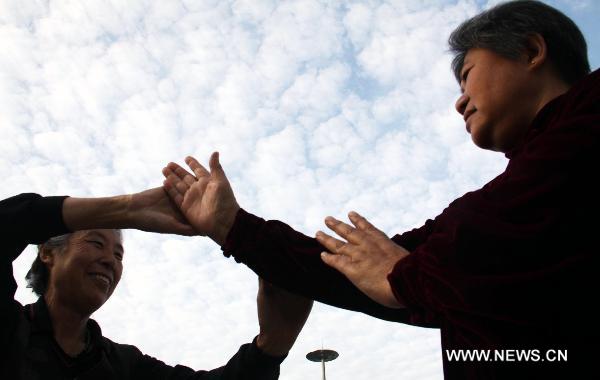 Two people practise Taiji martial in Cangzhou City, north China's Hebei Province, Sept. 25, 2010. The eighth Cangzhou International Martial Arts Festival was opened on Oct.9, 2010. 