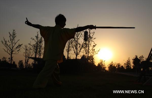 Wang Xiaoyang, 19 years old, practises during his preparation for the eighth Cangzhou International Martial Arts Festival in Cangzhou City, north China's Hebei Province, Sept. 29, 2010. The eighth Cangzhou International Martial Arts Festival was opened on Oct.9, 2010. 