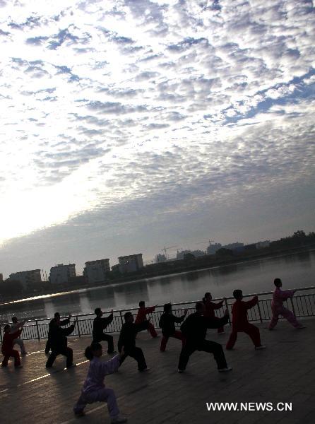 People practise martial arts in Cangzhou City, north China's Hebei Province, Sept. 25, 2010. The eighth Cangzhou International Martial Arts Festival was opened on Oct.9, 2010.