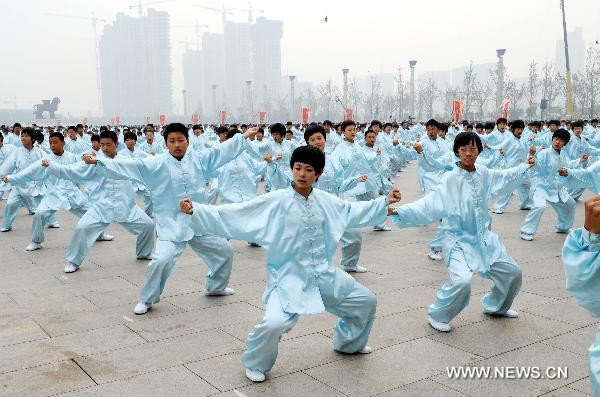 People perform traditional Chinese martial arts at Shicheng Square of Cangzhou City, north China's Hebei Province, Oct. 10, 2010. The eighth Cangzhou International Martial Arts Festival was opened on Oct.9, 2010.