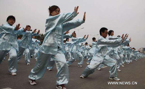 Students perform martial arts in Cangzhou City, north China's Hebei Province, Sept. 25, 2010. The eighth Cangzhou International Martial Arts Festival was opened on Oct.9, 2010.