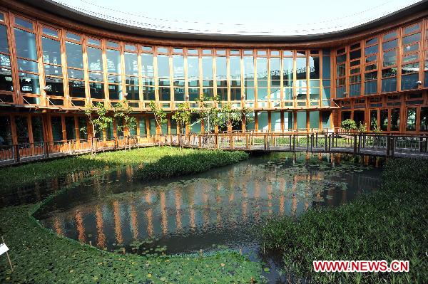 Photo taken on Oct. 13, 2010 shows the ecological pond at Pavilion of Future at 2010 Taipei International Flora Expo in Taipei, south China's Taiwan. The 15 theme zones at the Pavilion of Future opened to visitors for the first time on Wednesday. With the use of advanced technologies, the pavilion showcased the future environment where human and plants coexist harmoniously. [Xinhua/Wu Ching-teng]