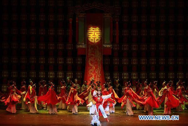 Dancers of the Beijing Friendship Dance Company perform on stage in the dance drama of Dream of the Red Chamber at Sony Theatre, Toronto, Canada, celebrating the 40th anniversary of the establishment of diplomatic relations between China and Canada, Oct. 12, 2010. Dream of the Red Chamber is a dance drama which mixes classical ballet and traditional Chinese dance.
