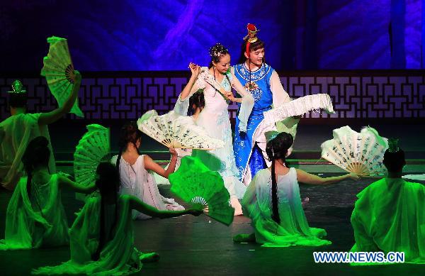 Dancers of the Beijing Friendship Dance Company perform on stage in the dance drama of Dream of the Red Chamber at Sony Theatre, Toronto, Canada, celebrating the 40th anniversary of the establishment of diplomatic relations between China and Canada, Oct. 12, 2010. Dream of the Red Chamber is a dance drama which mixes classical ballet and traditional Chinese dance.