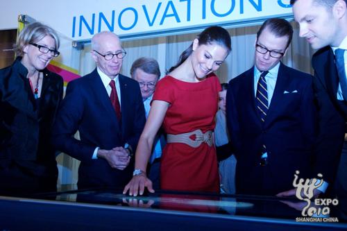 Swedish Crown Princess Victoria and Prince Daniel Westling visit the virtual autopsy table shown for the first time to the public at the Sweden Pavilion. 