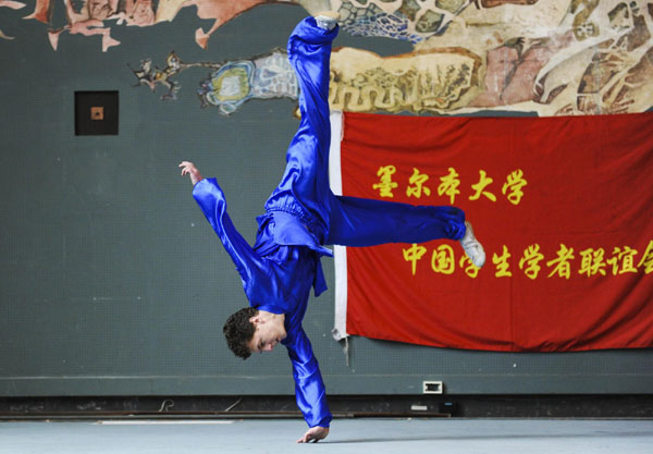 A student performs Chinese kungfu at the University of Melbourne, Oct 14, 2010. The third session of the Chinese Culture Festival was held at the University of Melbourne on Thursday. The event aims to promote traditional Chinese culture and increase Sino-Australian cultural exchanges. [Xinhua]