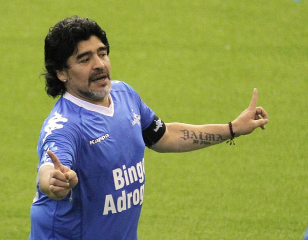 Former Argentina's national soccer team coach Diego Maradona gestures during a charity match for ex-soccer player Fernando Caceres in Buenos Aires October 16, 2010. Caceres was attacked in his car by a youth during a robbery attempt on November 1, 2009, leaving him in a coma. He lost an eye and the bullet is still lodged in his head. Doctors said it was a miracle he survived. (Xinhua/Reuters Photo)