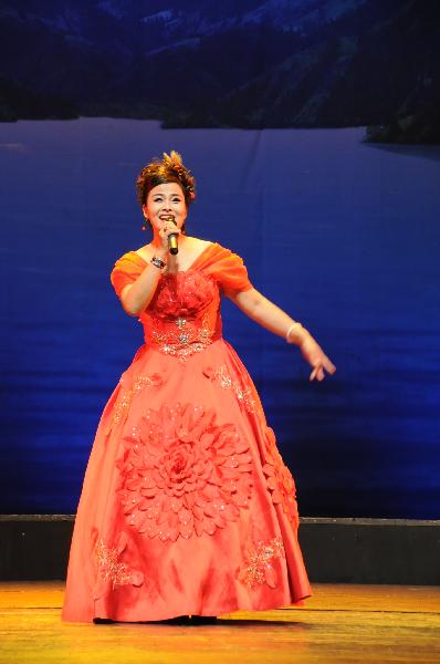 An actress performs a solo during a large-scale Chinese cultural event termed 'Experience China in Turkey' in Ankara, capital of Turkey, Oct. 17, 2010. The event kicked off with an ethnic dance and singing show in the Turkish capital of Ankara on Sunday night, drawing cheers and applauses from the audiences.
