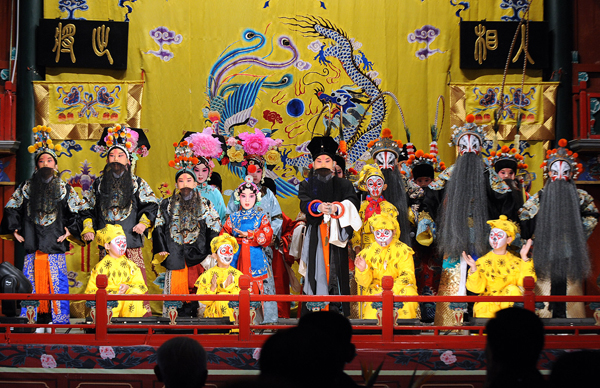 In the picture, primary school students perform Peking Opera in Beijing on October 17, 2010. [Xinhua photo] 