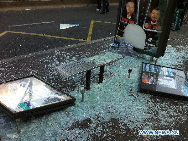 A bus stand is destroyed during a demonstration in the northern suburbs of Nanterre in Paris, France, Oct. 18, 2010. [Gao Zixuan/Xinhua]