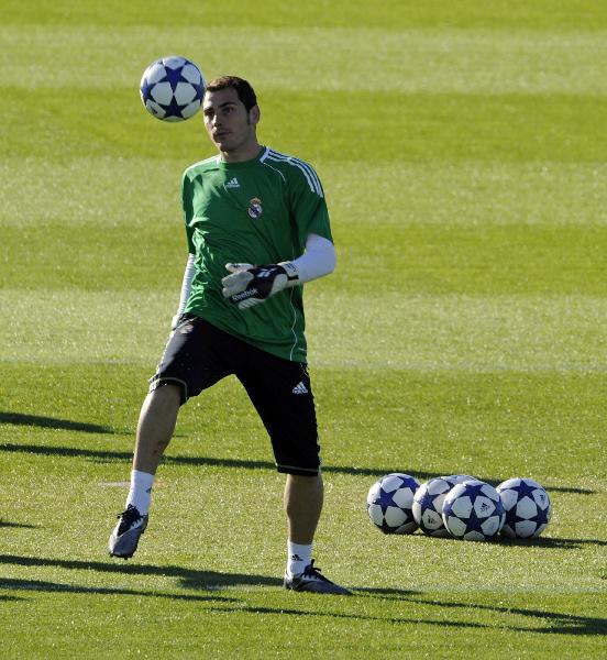 Real Madrid's goalkeeper Iker Casillas kicks the ball during a training session at team's Valdebebas soccer ground in Madrid October 18, 2010, on the eve of their Champions League soccer match against AC Milan. (Xinhua/AFP Photo)